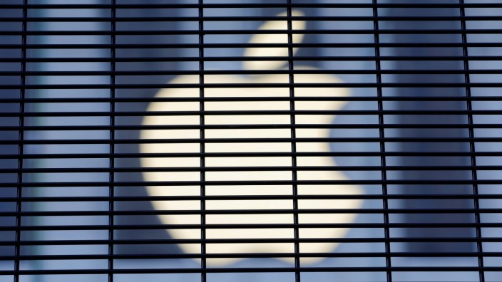 FILE PHOTO: The Apple logo is seen through a security fence erected around the Apple Fifth Avenue store