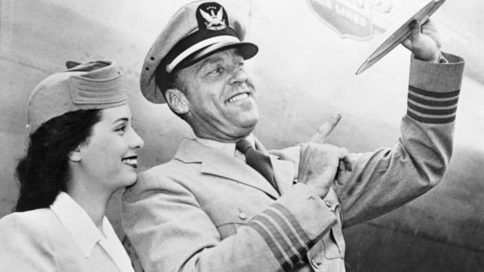 Capt. E. J. Smith & Stewardess Smiling