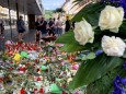 People lay flowers in German town of Wuerzburg after stabbing