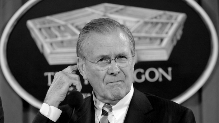 FILE PHOTO: Secretary of Defense Rumsfeld speaks during news briefing at Pentagon