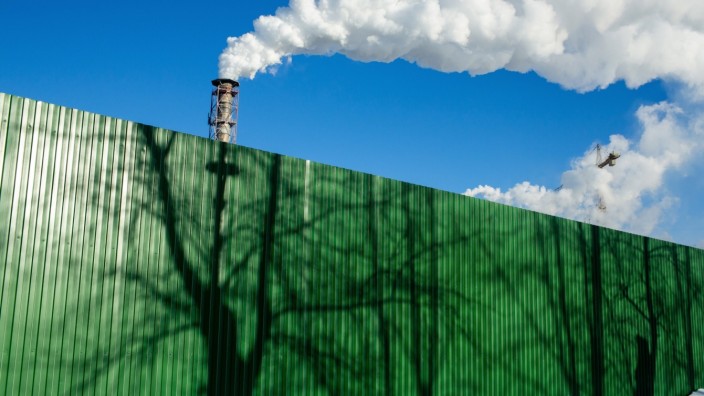 Green Fence And Chimney Vapor