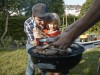 Family having a barbecue in garden model released Symbolfoto property released PUBLICATIONxINxGERxSU