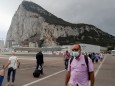 FILE PHOTO: People cross the tarmac of the airport in front of the Rock of Gibraltar in the British overseas territory of Gibraltar