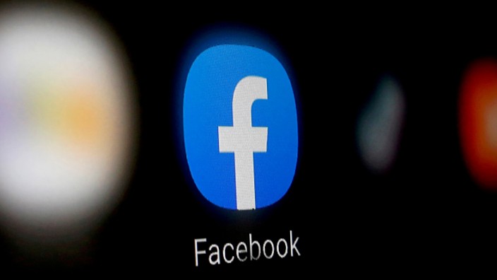 FILE PHOTO: FILE PHOTO: A Facebook logo is displayed on a smartphone in this illustration