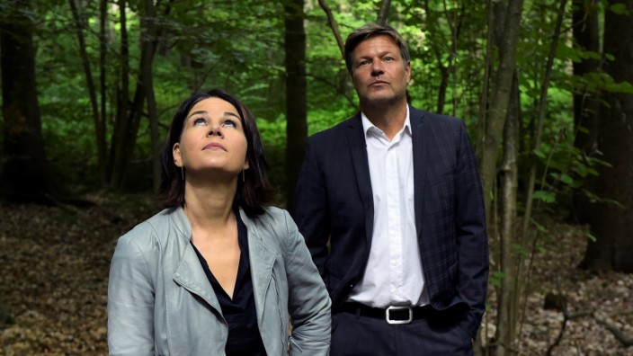 Co-leaders of Germany's Green party Habeck and Baerbock walk at the moors of the Biesenthaler Basin nature reserve