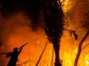 (210805) -- ATHENS, Aug. 5, 2021 -- A firefighter tries to put out a wildfire in the north of Athens, Greece, on Aug. 5,