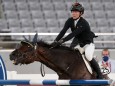TOKYO, JAPAN - AUGUST 6, 2021: Germany s Annika Schleu competes in the women s individual riding show jumping event duri