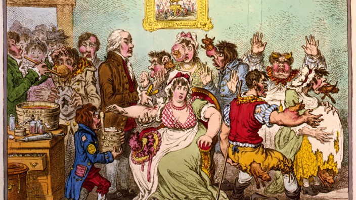 Die Geschichte der Impfskepsis: Inflation der Rindviecher: Eine Karikatur um 1800 zeigt, wie bei einer Pockenimpfung den Geimpften Kühe aus diversen Körperteilen wachsen.