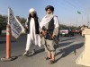 Taliban fighters stand outside the Interior Ministry in Kabul