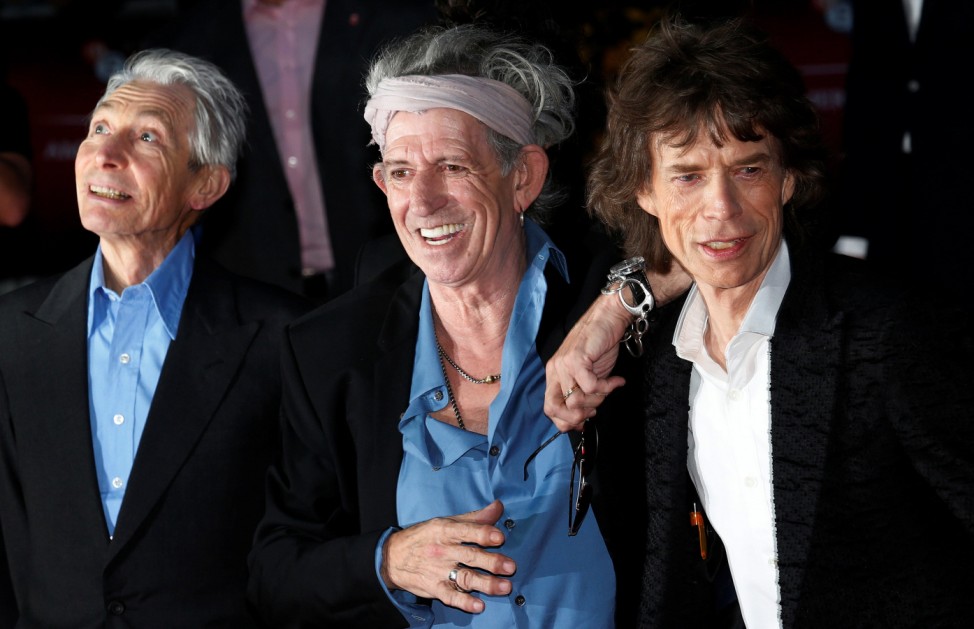 FILE PHOTO: Rolling Stones members Watts, Richards and Jagger arrive for the world premiere of 'Crossfire Hurricane' at the Odeon Leicester Square in London