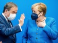 Christian Democratic Union (CDU) leader Laschet talks to Chancellor Merkel before a CDU leadership meeting in Berlin