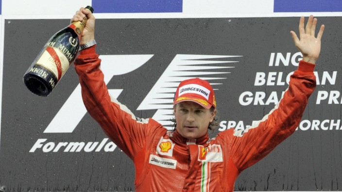 - FRANCORCHAMPS, BELGIUM: L-R, second placed Italian Giancarlo Fisichella of Force India and winner Finnish Kimi Raikko