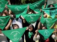 FILE PHOTO: Women hold green handkerchiefs during a protest in support of legal and safe abortion in Mexico City