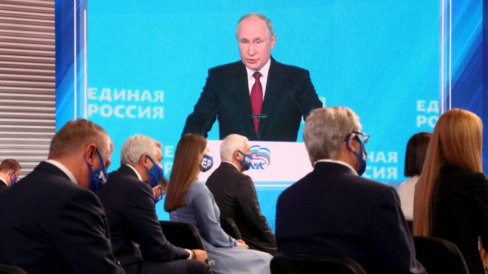 MOSCOW, RUSSIA   AUGUST 24, 2021: Russia s President Vladimir Putin (on the screen) makes remarks at the second stage of; putin