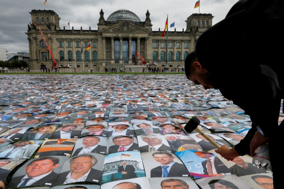 Human rights activists protest in front of the Reichstag in Berlin
