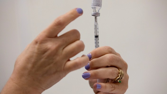 People receive COVID-19 booster vaccination in Michigan