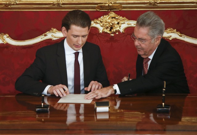 Austrian President Heinz Fischer and new Foreign Minister Kurz sign inauguration paper during a ceremony in Hofburg Palace in Vienna