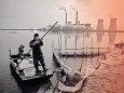 Fisherman punts a boat on a lake in front of a power plant of the State Development and Investment Corporation (SDIC) outside Tianjin