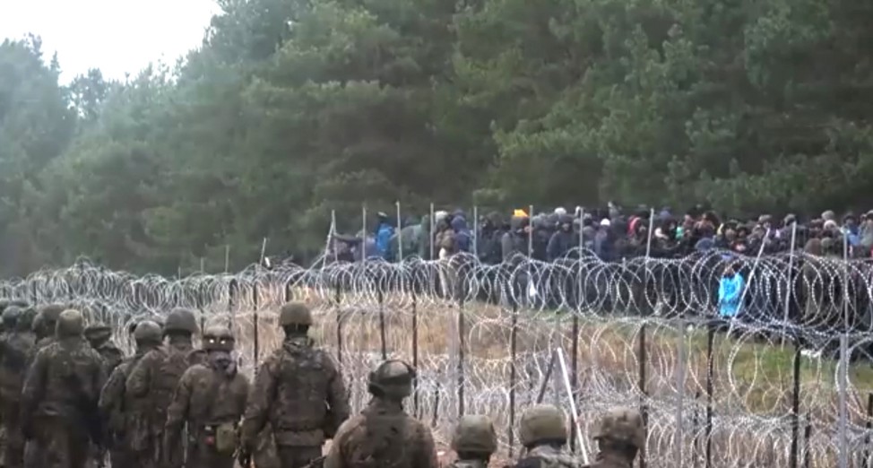 Hundreds of migrants try to cross from the Belarus side of the border with Poland near Kuznica Bialostocka