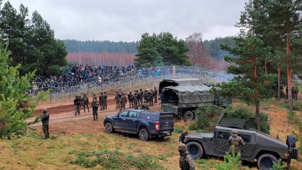Polish Soldiers guard hundreds of migrants at the Polish/Belarus border near Kuznica Bialostocka