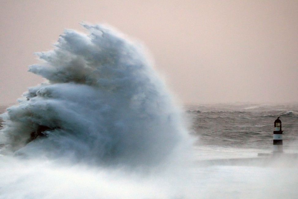 Waves crash against the pier wall at Seaham Lighthouse during Storm Arwen, in Seaham