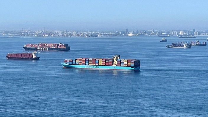 FILE PHOTO: Container ships wait off the coast of the congested Ports of Los Angeles and Long Beach in Long Beach, California
