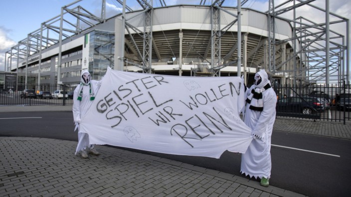 Mönchengladbach, Germany, Borussiapark, 11.03.2020: Fans with ghost costume Geisterspiel wir wollen rein prior the Bund