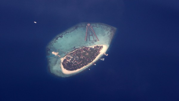 An aerial view of a resort island in the Maldives
