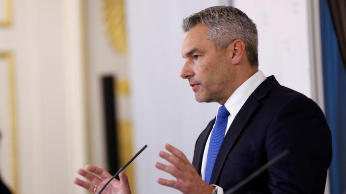 Austrian Interior Minister Karl Nehammer attends a news conference in Vienna
