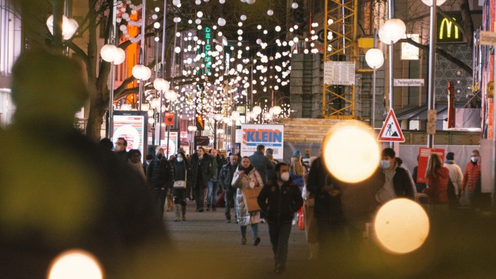German Excludes Unvaccinated From Parts Of Culture Life shoppers are seen under the Christmas lights in city center of