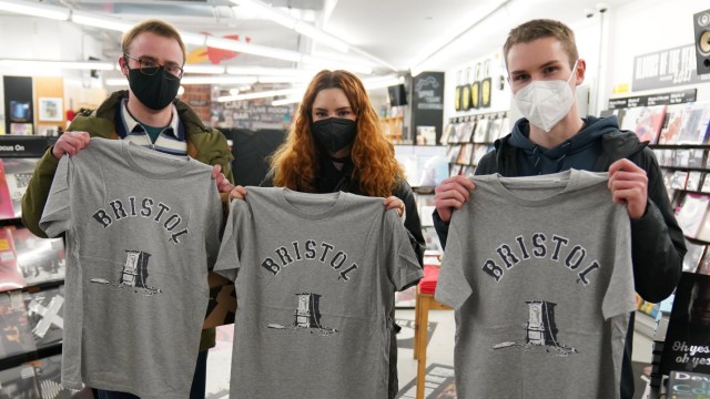 December 11, 2021, Bristol, UK: Customers in Rough Trade in Bristol, with a T-shirt designed by street artist Banksy be
