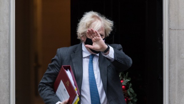 Boris Johnson Leaves Downing Street For PMQs LONDON, UNITED KINGDOM - DECEMBER 15, 2021: British Prime Minister Boris J