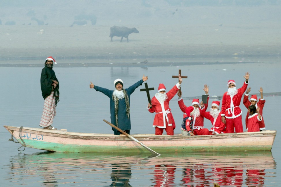 Pakistani members of Bright Future Society and IMRF wearing costumes of Santa Clause Pakistani members of Bright Future