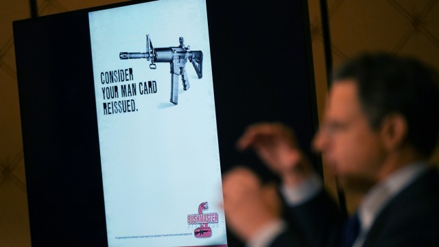USA: Attorney Josh Koskoff shows examples of Bushmaster's advertisements for their AR-15 variant during a press conference.