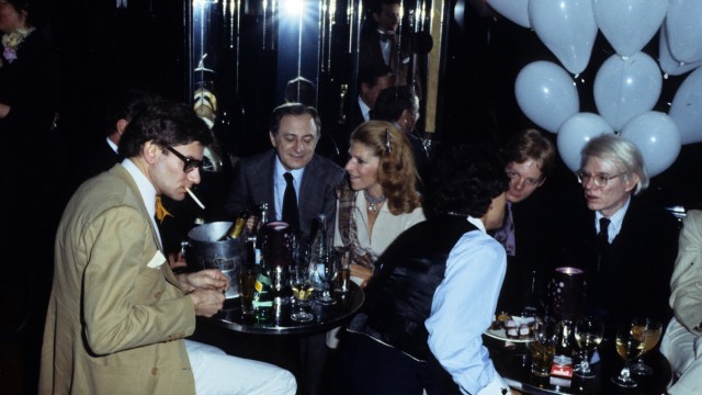 The relationship between fashion and art: Yves Saint Laurent, his partner Pierre Bergé and Andy Warhol in 1977 at a party at Le Palace in Paris.