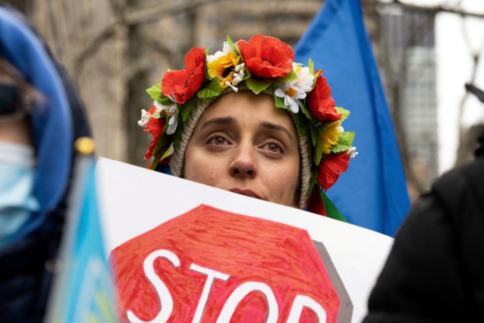 People take part in a protest against Russia's massive military operation in Ukraine in New York