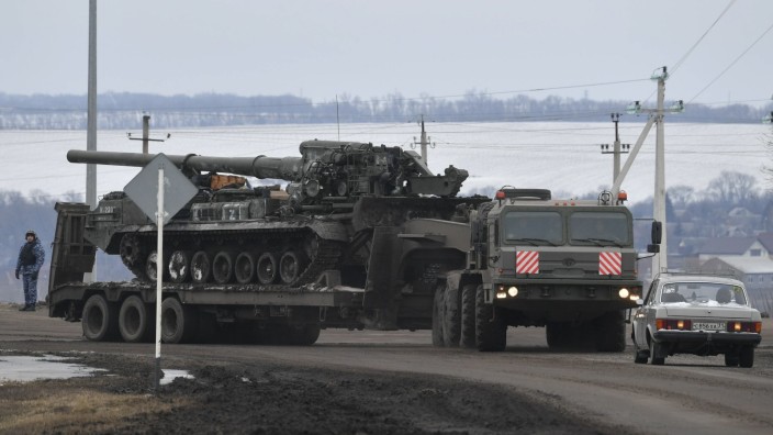 Russia Ukraine Military Operation 8128381 28.02.2022 A military truck carrying a 2S7 Pion self-propelled heavy artiller