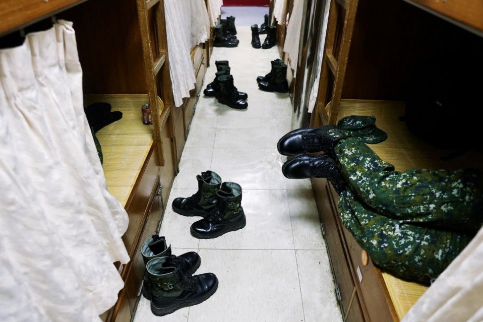 A soldier who finished a month of training takes a break on the ferry and is about to finish the rest of his three-month mandatory military service in Matsu, Dongyin