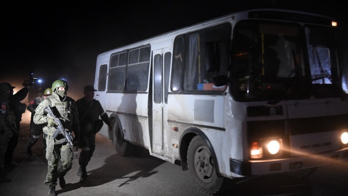 DPR Russia Ukraine Military Operation 8192513 16.05.2022 DPR s servicemen accompany the bus with the wounded Ukrainian s