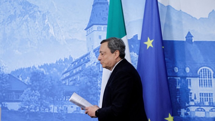 FILE PHOTO: Italian Prime Minister Mario Draghi leaves after addressing the media following the G7 summit