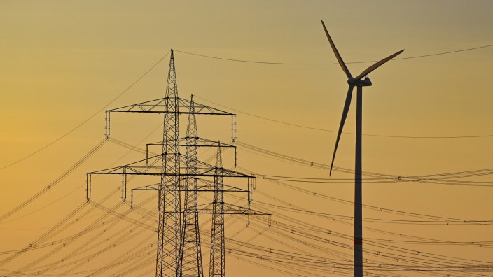 Energy: wind turbine and electricity pylons in Brandenburg