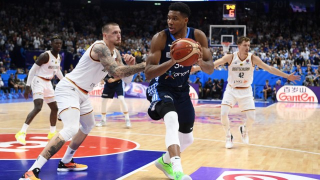 Basketball European Championship: Giannis Antetokounmpo (centre), perhaps the most complete basketball player in the world, is stopped by Daniel Theis (left) in this action.