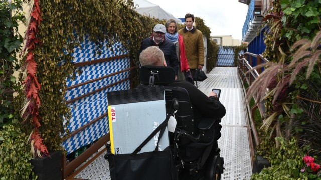 Accessibility test.  Markus Dieminger uses a ramp to access the wheelchair accessible gondolas.