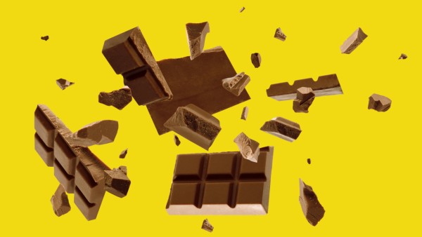 Milk chocolate pieces falling