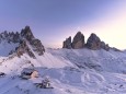 Dreizinnenhütte, Sunset over Monte Paterno, Tre Cime di Lavaredo and Locatelli hut covered with snow, Sesto Dolomites, South Tyrol, Italy