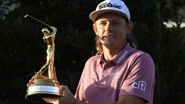 Controversy in golf: Cameron Smith won't be gilding his game anytime soon on the PGA Tour - here he poses with his trophy for winning the 2022 Players Championship.