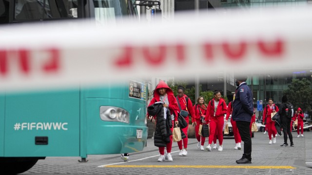 New Zealand: Players of the Philippine national team on the way to the bus.  Your quarters are close to the crime scene.