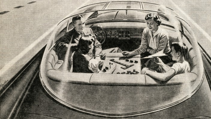 Autonomes Fahren: Familie beim Brettspiel mitten auf dem Highway: So entspannt stellte man sich das autonome Fahren in den Fünfzigerjahren vor. Die Autos orientieren sich an einem Leitband in der Fahrbahn.