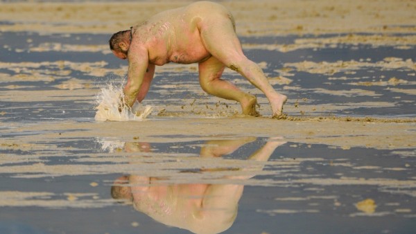 Syndication: Reno Gazette Journal Dirty D of Los Angeles dives into the mud at Burning Man. Like many Burning Man attend