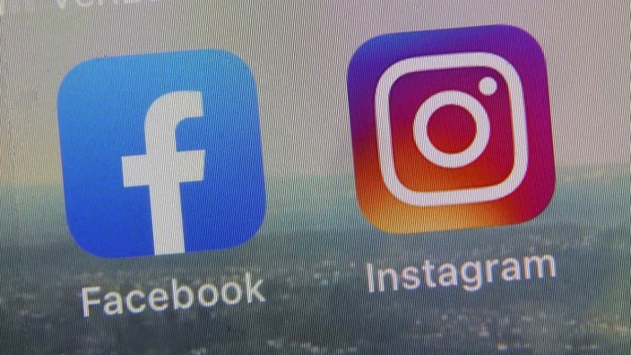 Meta: Logos von Facebook und Instagram auf einem Smartphone-Bildschirm.
